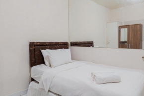 Comfy Studio Apartment No Kitchen at Aeropolis Residence near Soetta By Travelio